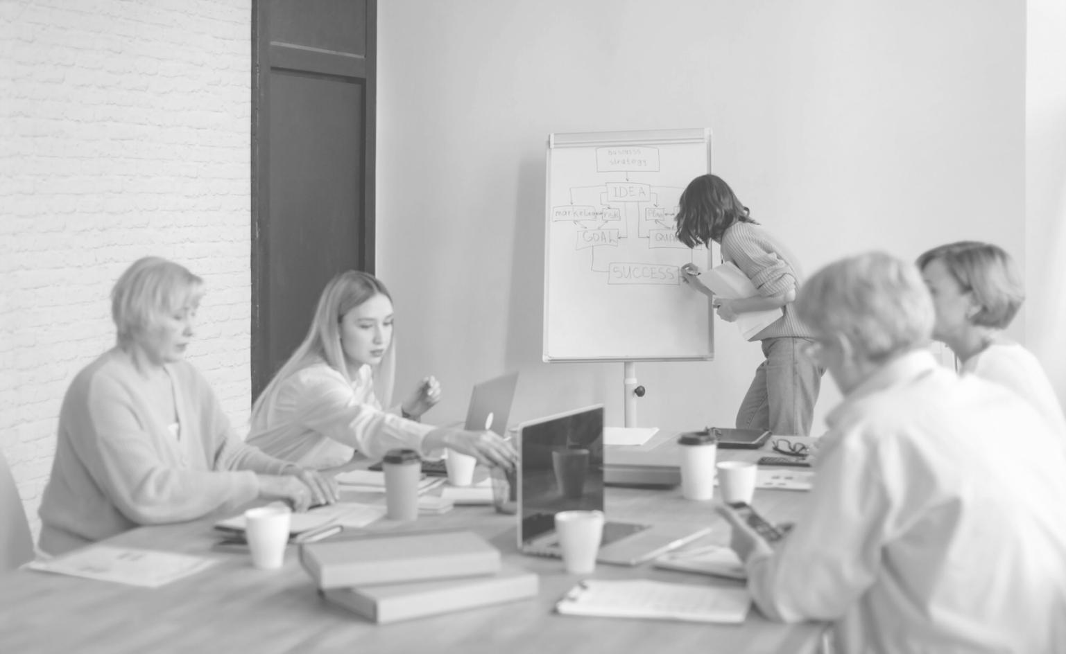 Modern office workspace showing financial analysis tools and collaborative environment